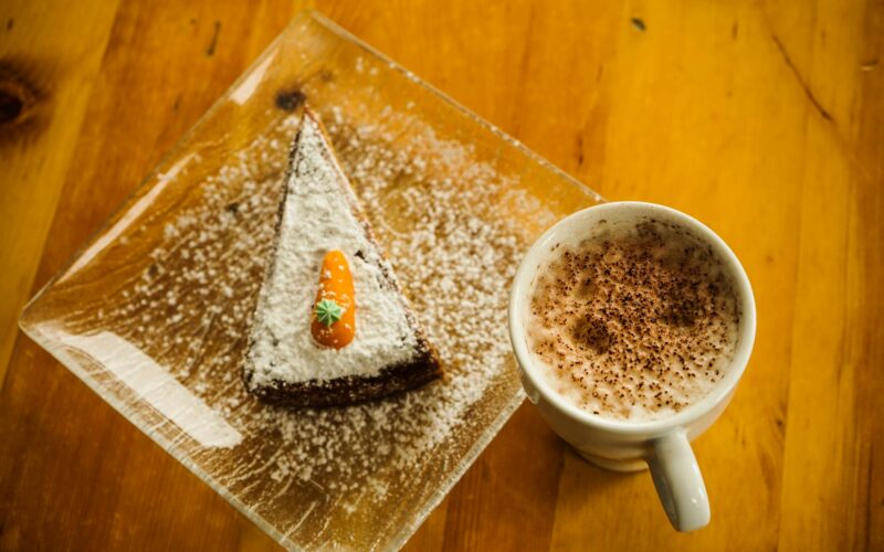 white ceramic cup and dessert
